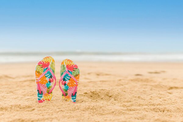 colorful flip flops slipper in the beach san